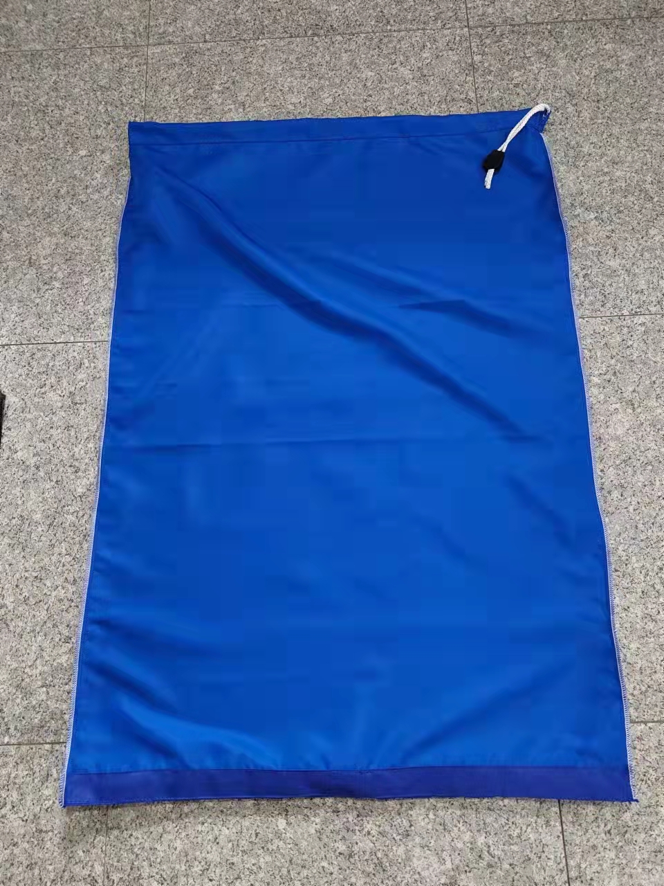 Industrial laundry bag shown from the reverse side, laid flat